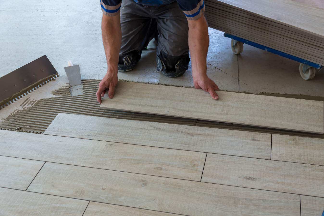 a man working on a wood floor